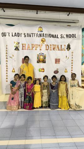 The Happy Diwali backdrop in the auditorium