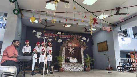 Carols sung in front of the crib