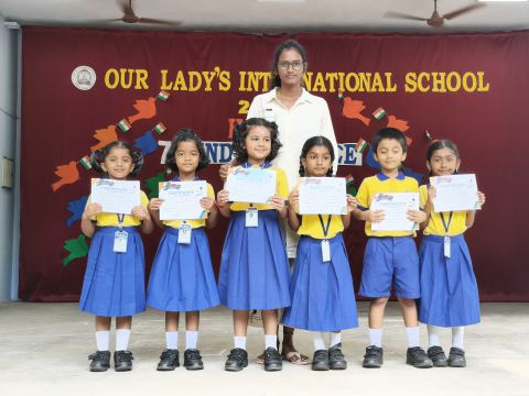 A class with their achievement certificates