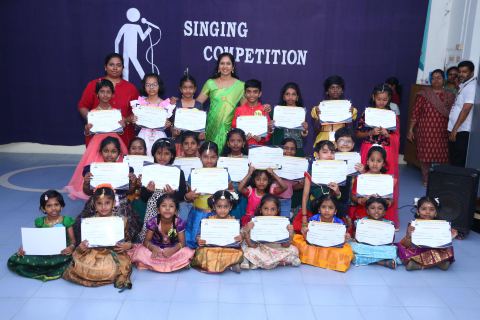 Singing competition winners with their teachers